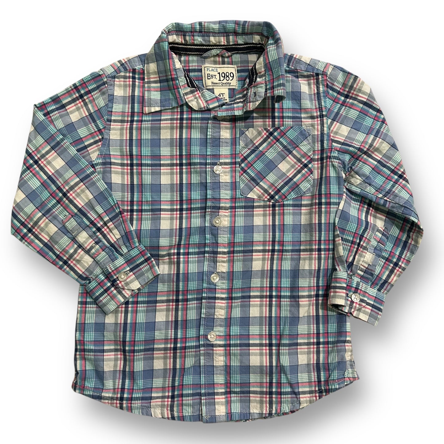 A long sleeve button down shirt with a blue and beige plaid pattern, displayed on a hanger.
