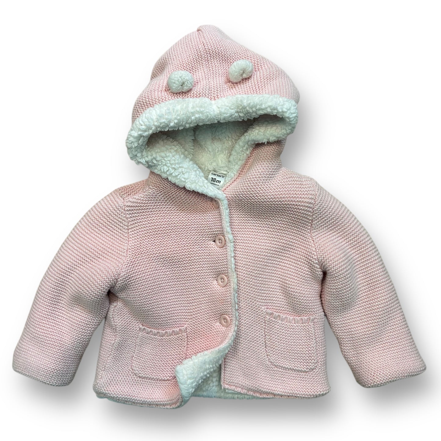 A pink knit sweater coat with a Sherpa lining for a baby girl, featuring a hood and a frontal button.