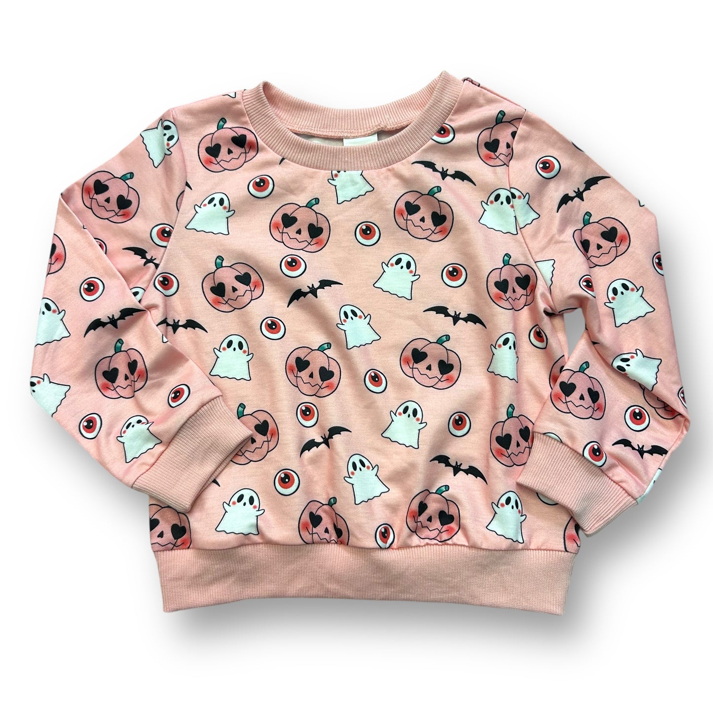 A pink sweatshirt with a halloween print featuring ghosts, pumpkins, and bats.