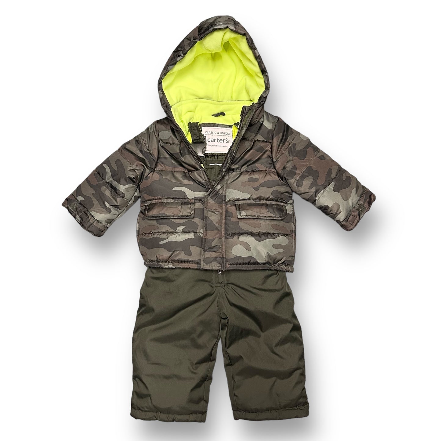 A green camouflage winter coat and bib overall snow suit for a toddler.