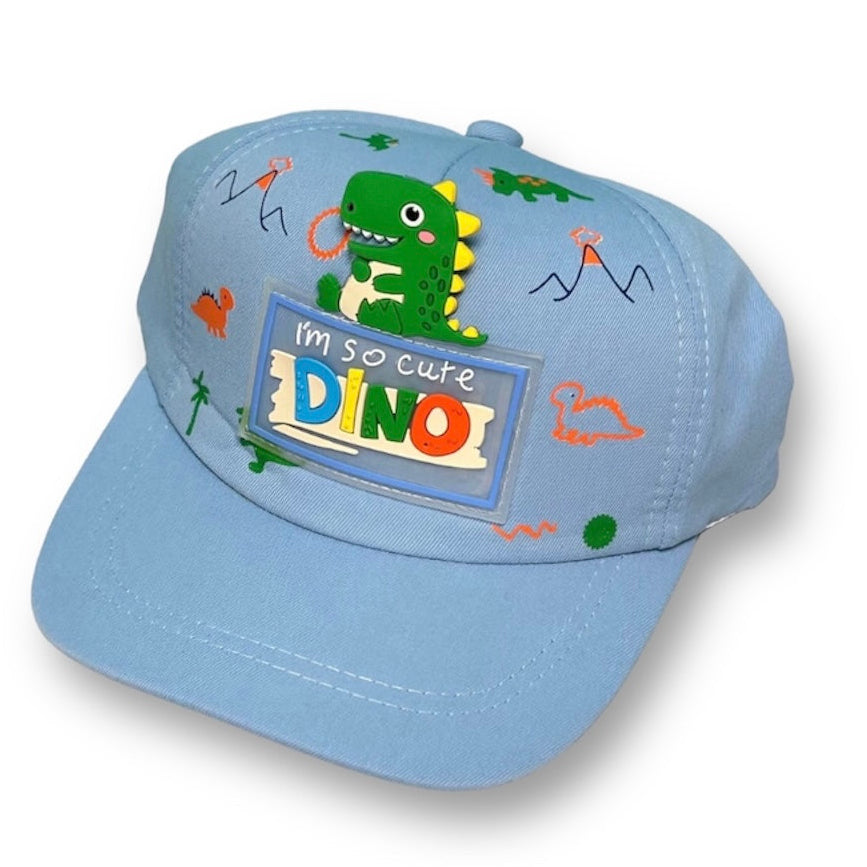 A blue toddler hat with a dinosaur design and the text 'I'm so cute DINO'.