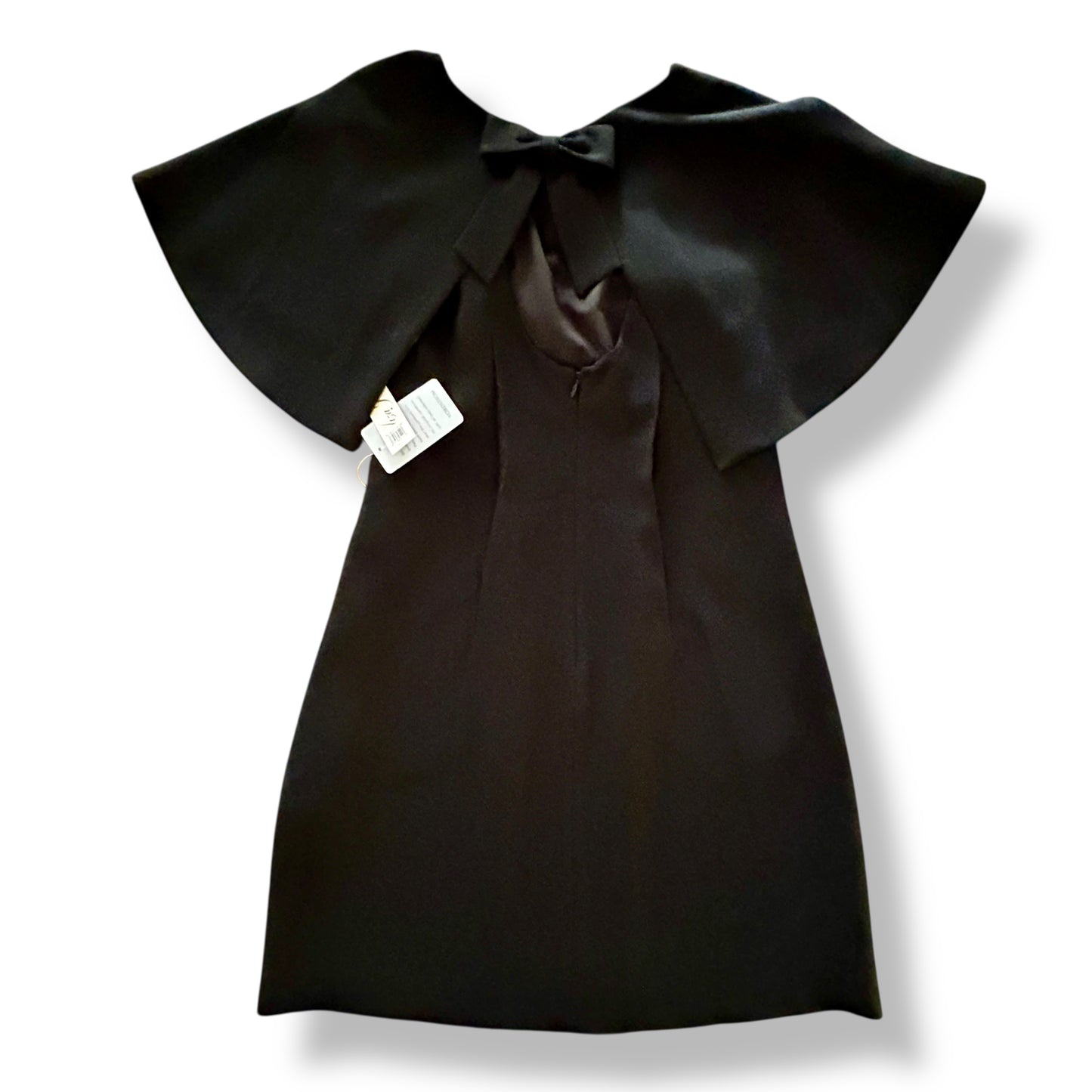 Black dress with a large bow collar on a white background