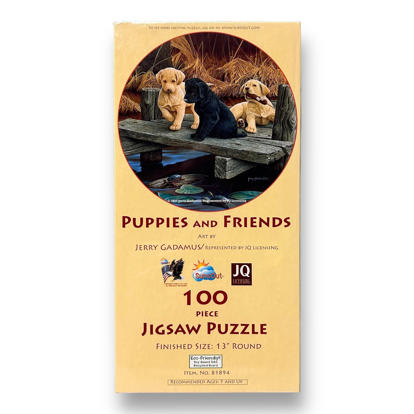 A 100-piece jigsaw puzzle depicting a group of puppies and adult dogs on a wooden structure with grass and trees in the background.