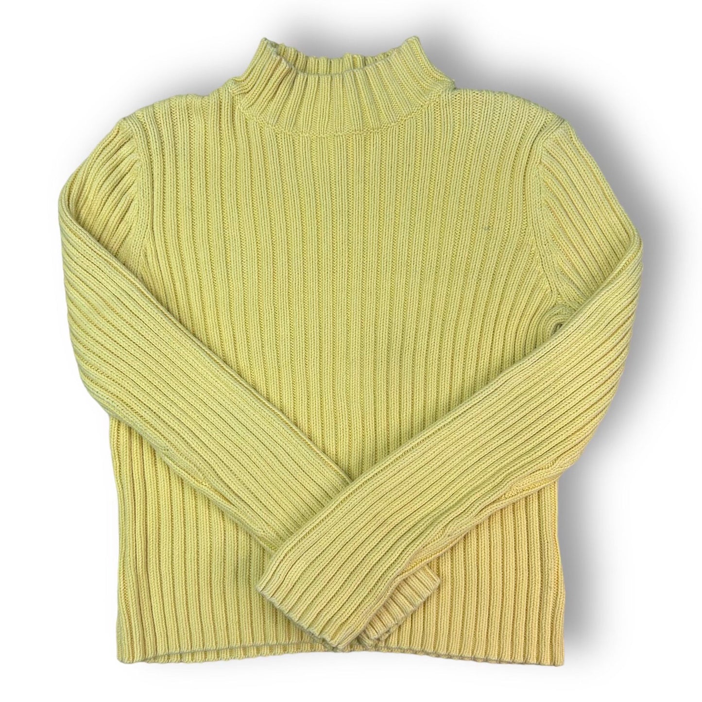 A yellow mock turtleneck sweater by Valerie Stevens, displayed on a mannequin against a white background.