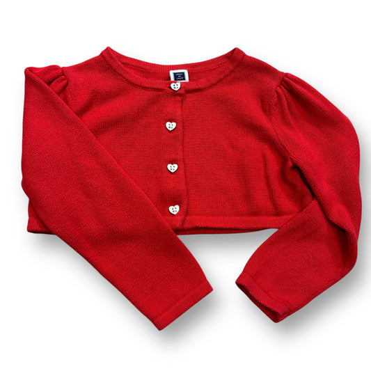 A bright red cardigan with heart-shaped buttons and a round neckline, designed for girls in a 2T size.