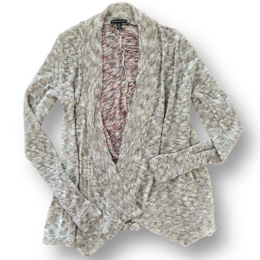 Textured cardigan with a pink interior on a white background