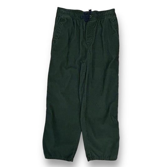 Hunter green cotton corduroy pants for boys, with elastic waistband and drawstrings, displayed against a white background.