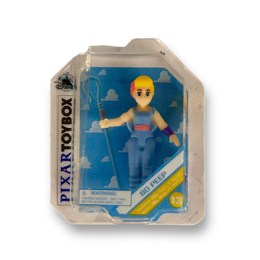 Disney Mini Brands Pixar Toybox Toy Story Bo Peep figure in a resealable Mylar gift bag with a blue background.