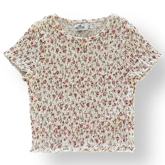 Floral patterned top on a light gray background
