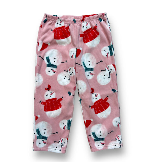 Pink fleece pajama bottoms with a Christmas snowman pattern, including red and white snowflakes and a pink snowman.