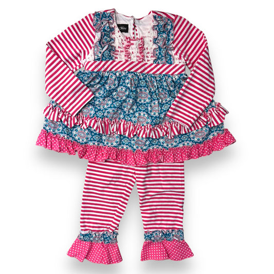 A pink and teal ruffled boutique outfit for girls, featuring a sleeveless top with a floral pattern and polka dots, and pink ruffled pants.