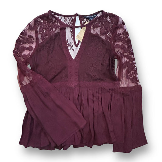 Junior Girls Long Sleeve Lace Top in purple color with a V-neckline and keyhole back.