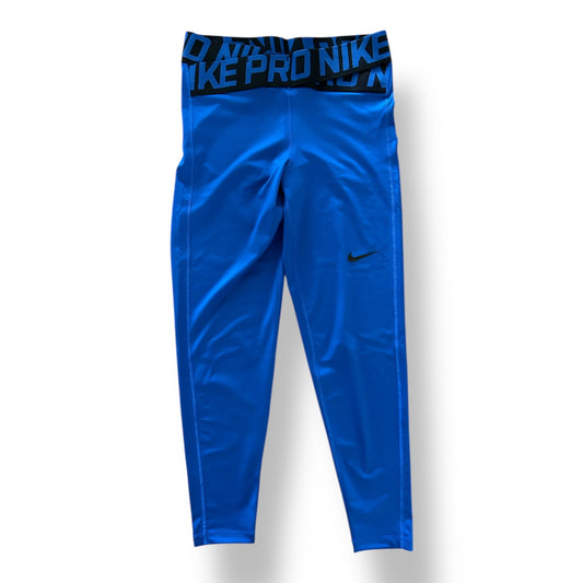 Blue athletic pants with Nike logo on a white background