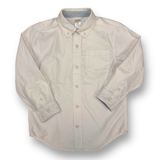 A white long sleeve button down dress shirt for boys, displayed on a plain background.