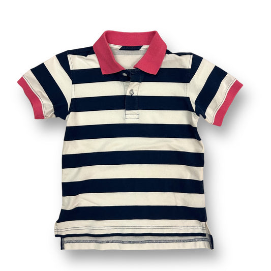 A navy and white striped polo shirt with short sleeves and a pink collar for girls size 5/6.