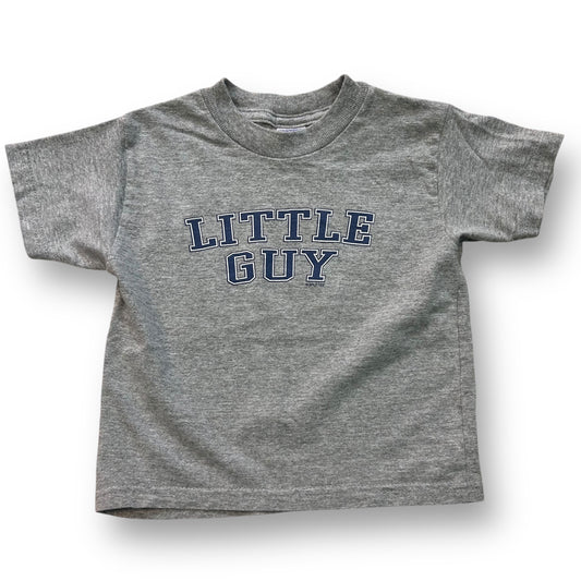 A gray short-sleeved t-shirt with 'LITTLE GUY' printed in blue text on the front.
