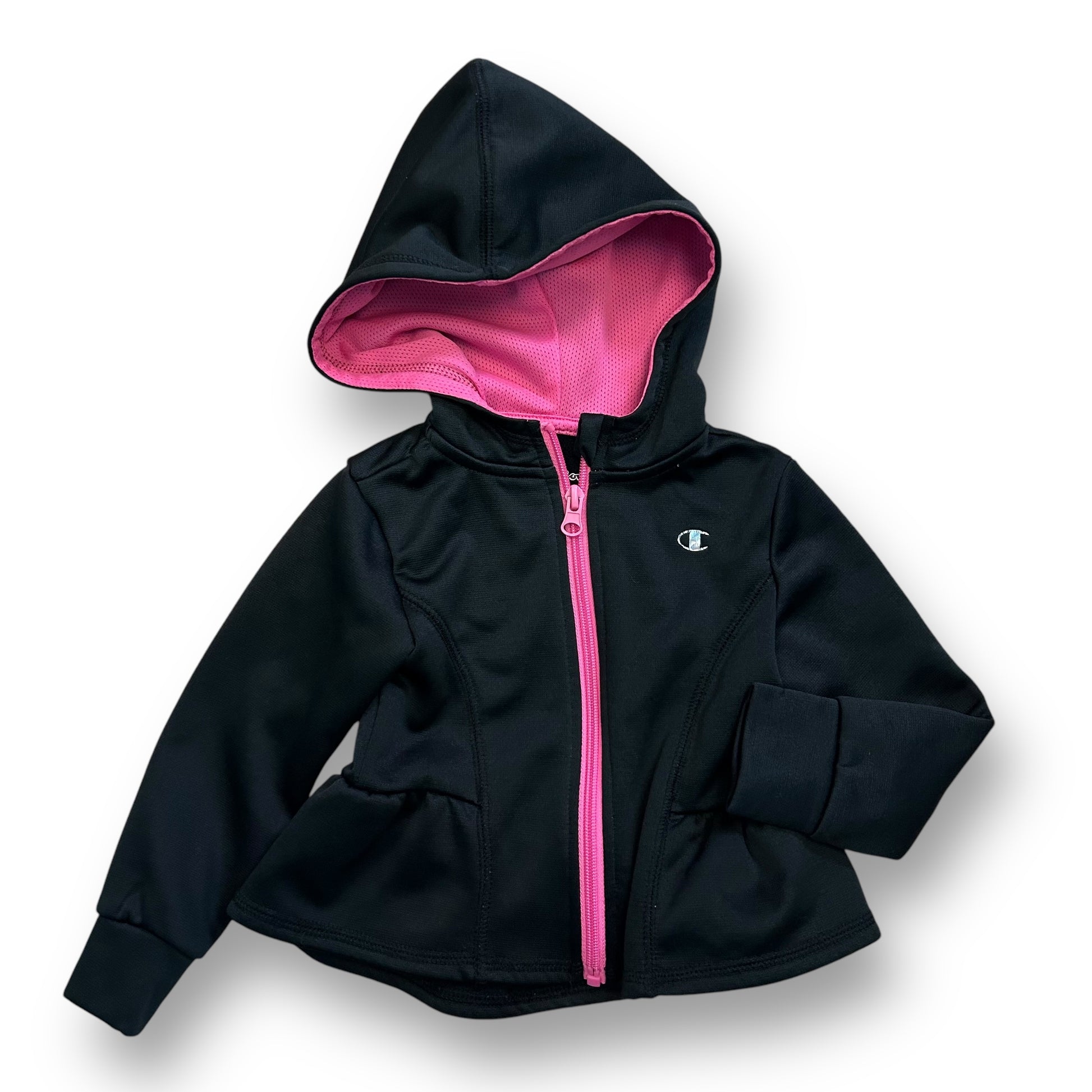 Girls black zippered hoodie with pink ruffle bottom and a logo on the chest.
