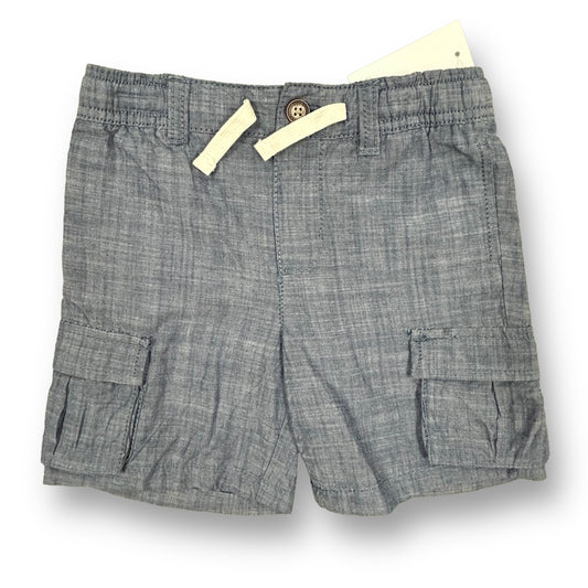 A pair of boys' khaki shorts with elastic waist, displayed on a flat surface.