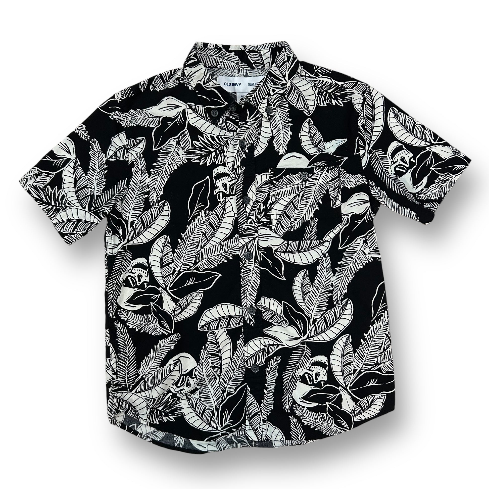 A black and white tropical print button down shirt for boys displayed on a hanger.