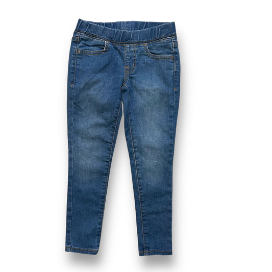 A pair of girls' denim elastic band jean jeggings.