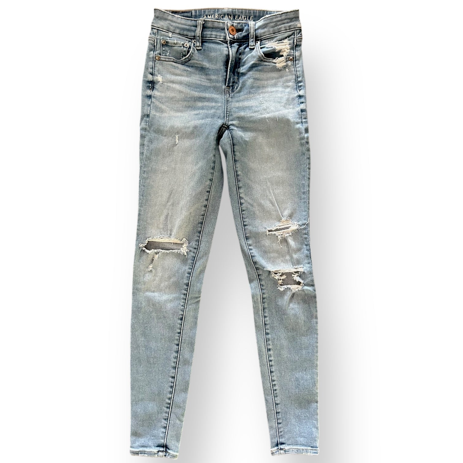 Distressed American Eagle jeans on a white background