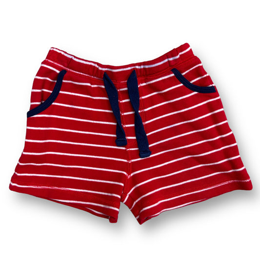 Red and white striped sweat shorts for boys with a drawstring waist and pockets on the sides.