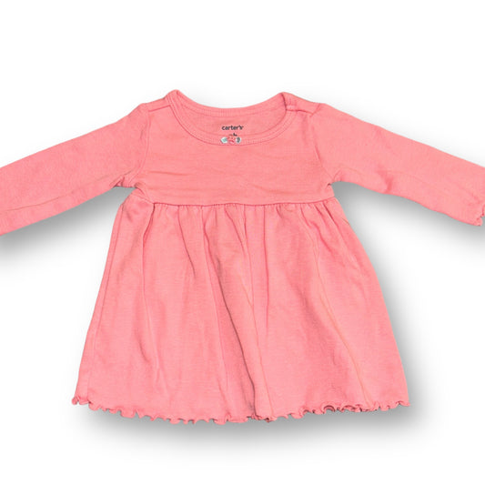 A pink long sleeve dress for newborns by Carter's, displayed against a white background.