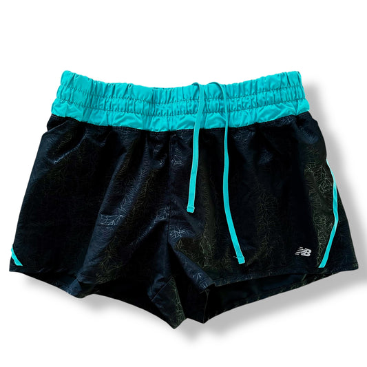 Black shorts with teal drawstring and waistband on a white background