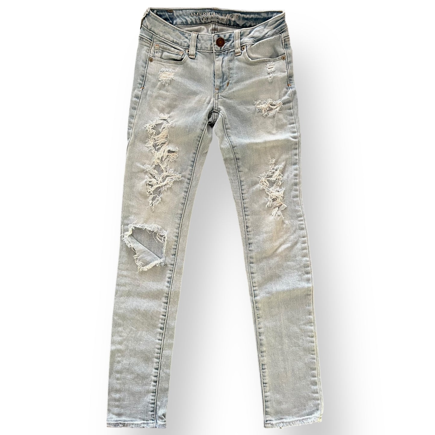 Distressed American Eagle jeans on a white background
