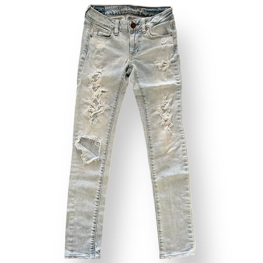 Distressed American Eagle jeans on a white background