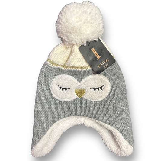 A gray knit beanie with a penguin face design and a white pom-pom on top, lined with a sherpa fabric.