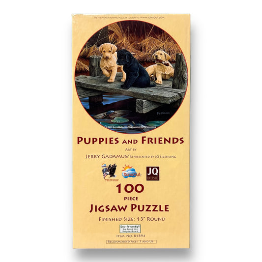 A 100-piece jigsaw puzzle depicting a group of puppies and adult dogs on a wooden structure with grass and trees in the background.