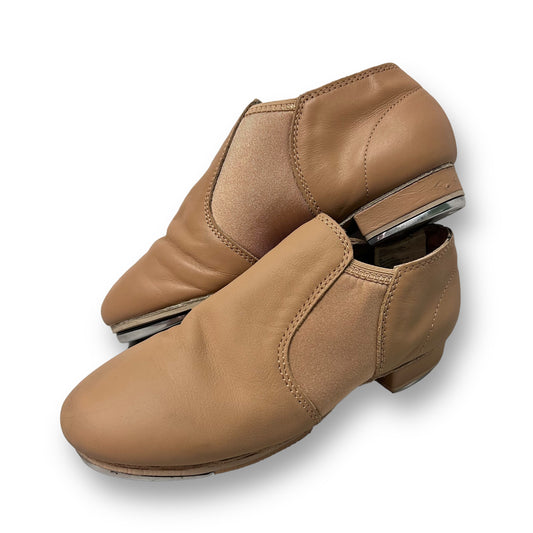 A pair of nude soft stretch women's tap shoes with a size 7 indicated.