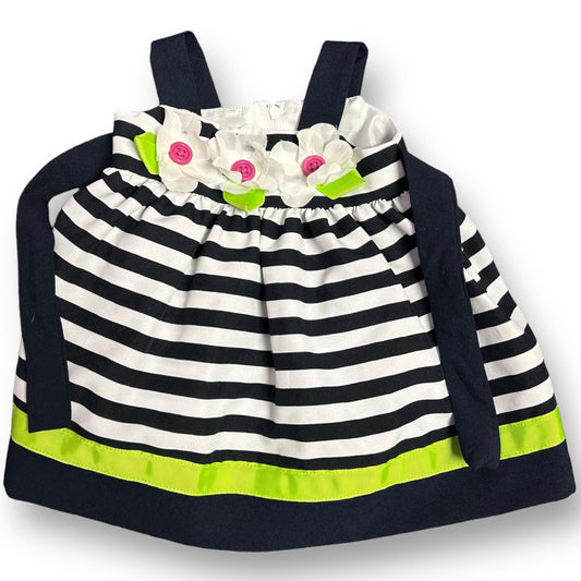 Girls' navy and white striped spaghetti strap dress with a V-neckline and short sleeves, decorated with small white flowers and green details.